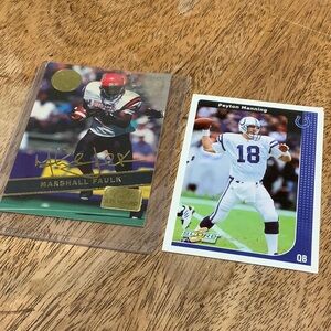 Two football playing cards- Peyton Manning and Marshall Faulk